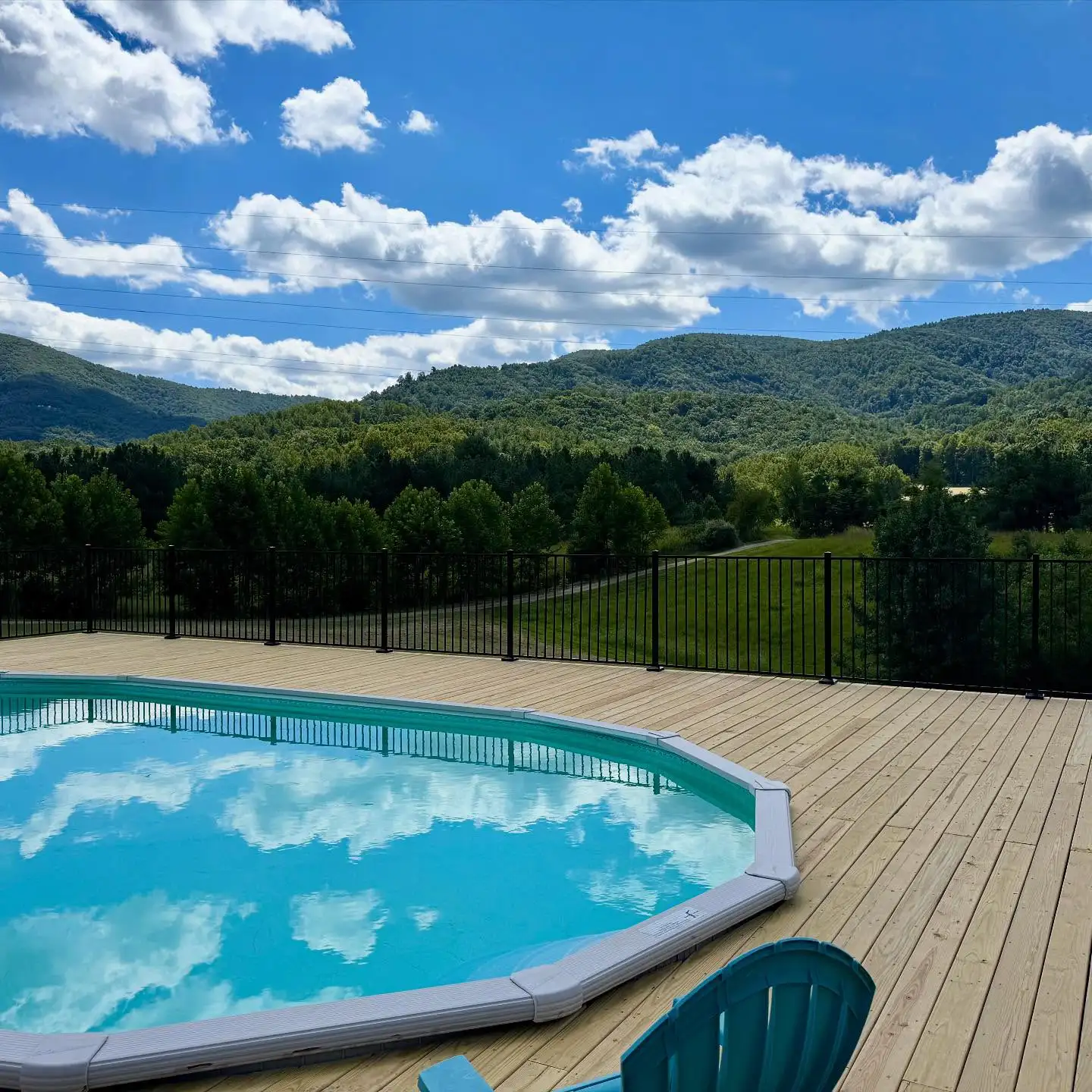 Black aluminum pool fence around a backyard pool in the Roanoke Valley, VA