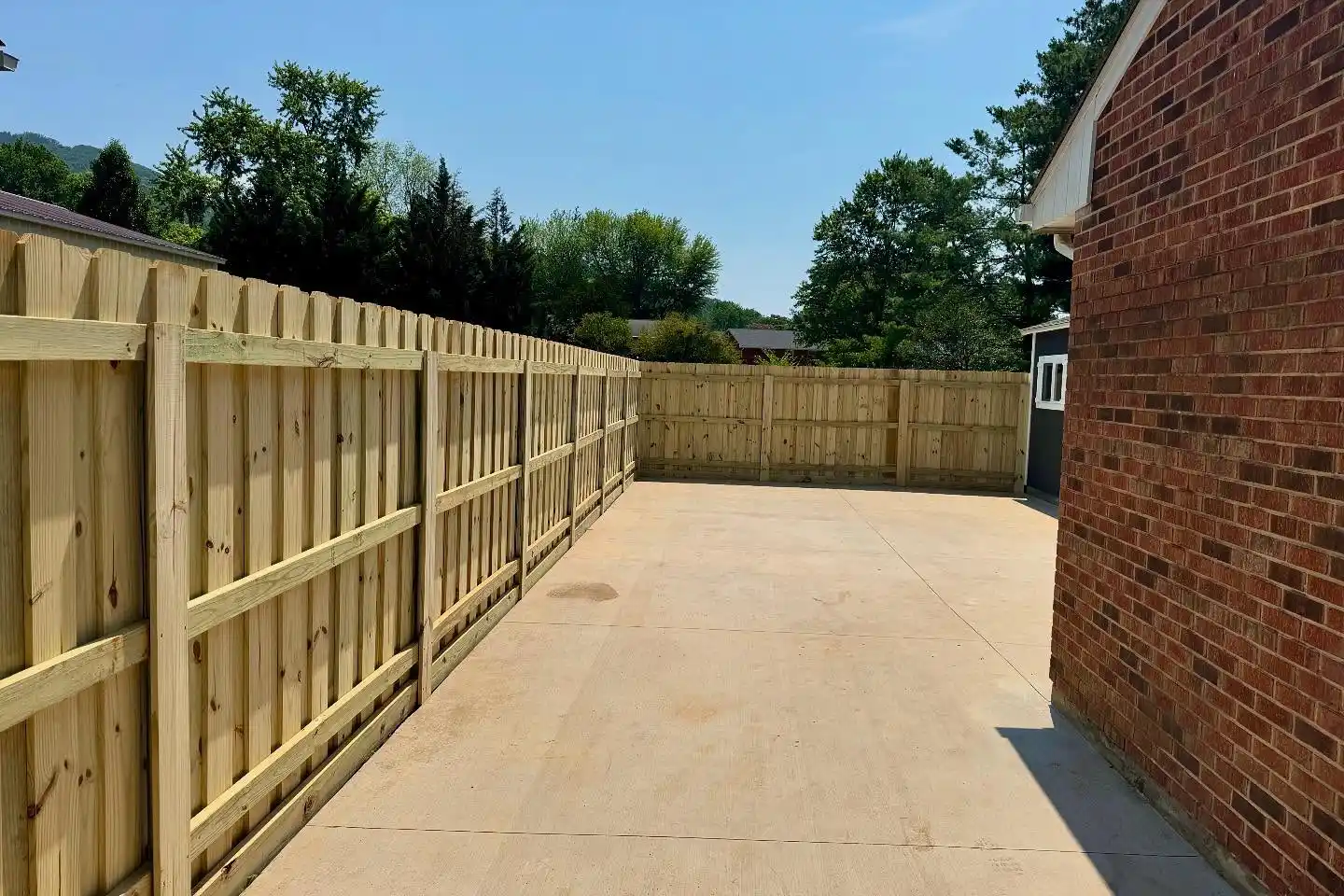 Board-on-board wood privacy fence installed in Hollins, VA