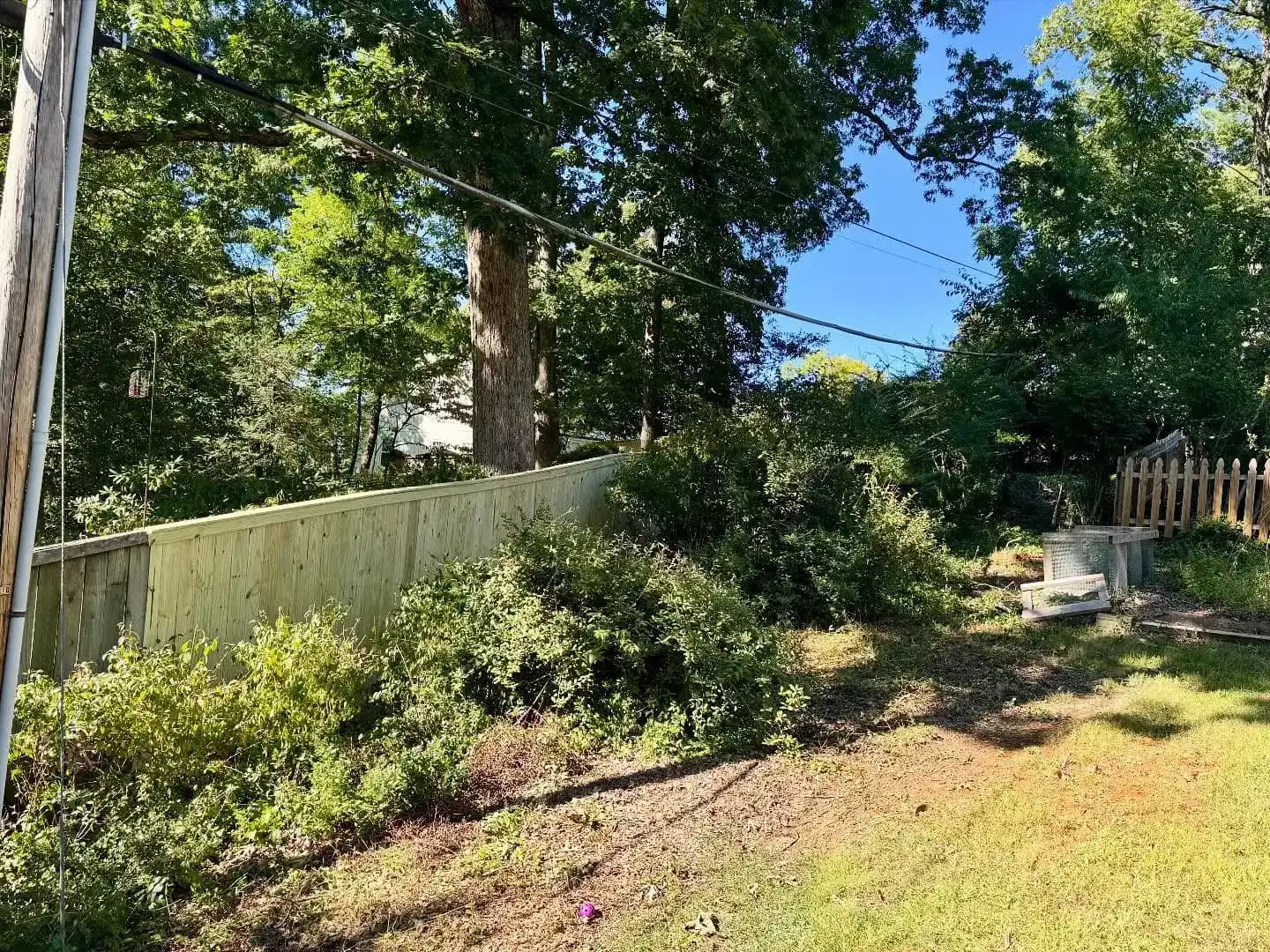Wooden cap fence installation in Roanoke Valley Va